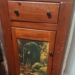 Rustic Wooden Cabinet with Bear Artwork